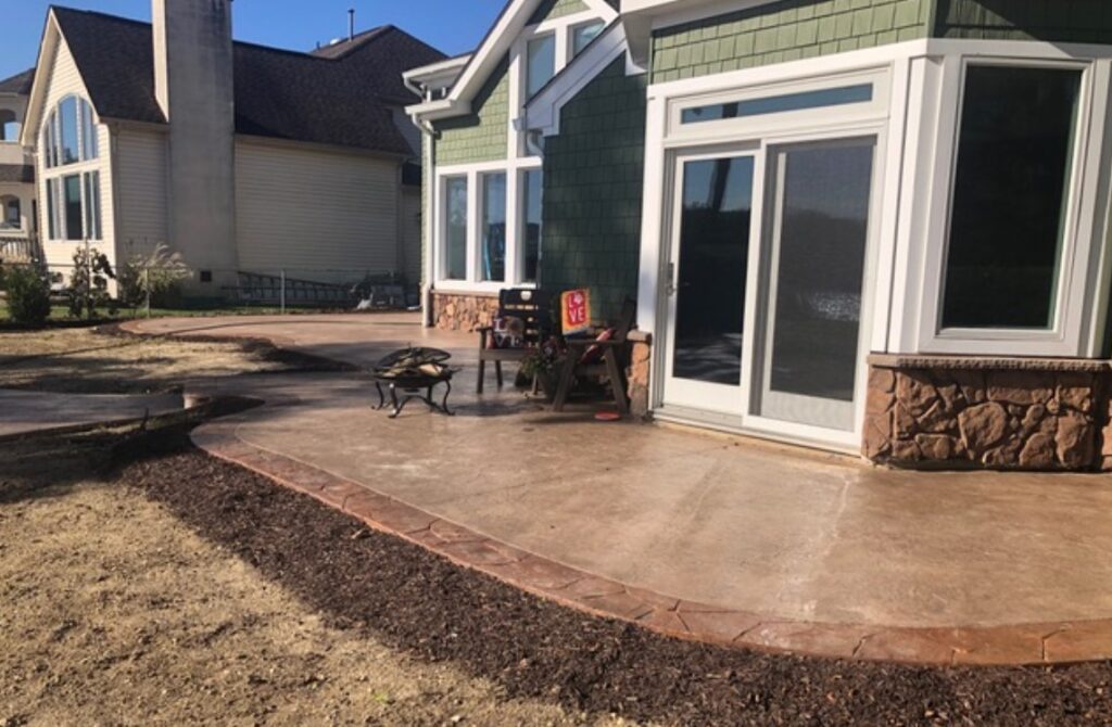 Stained decorative concrete pool deck by Jersey Concrete